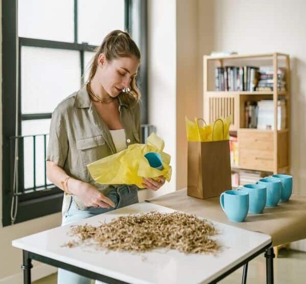 Website Migration Support 3 woman packing mugs for shipping